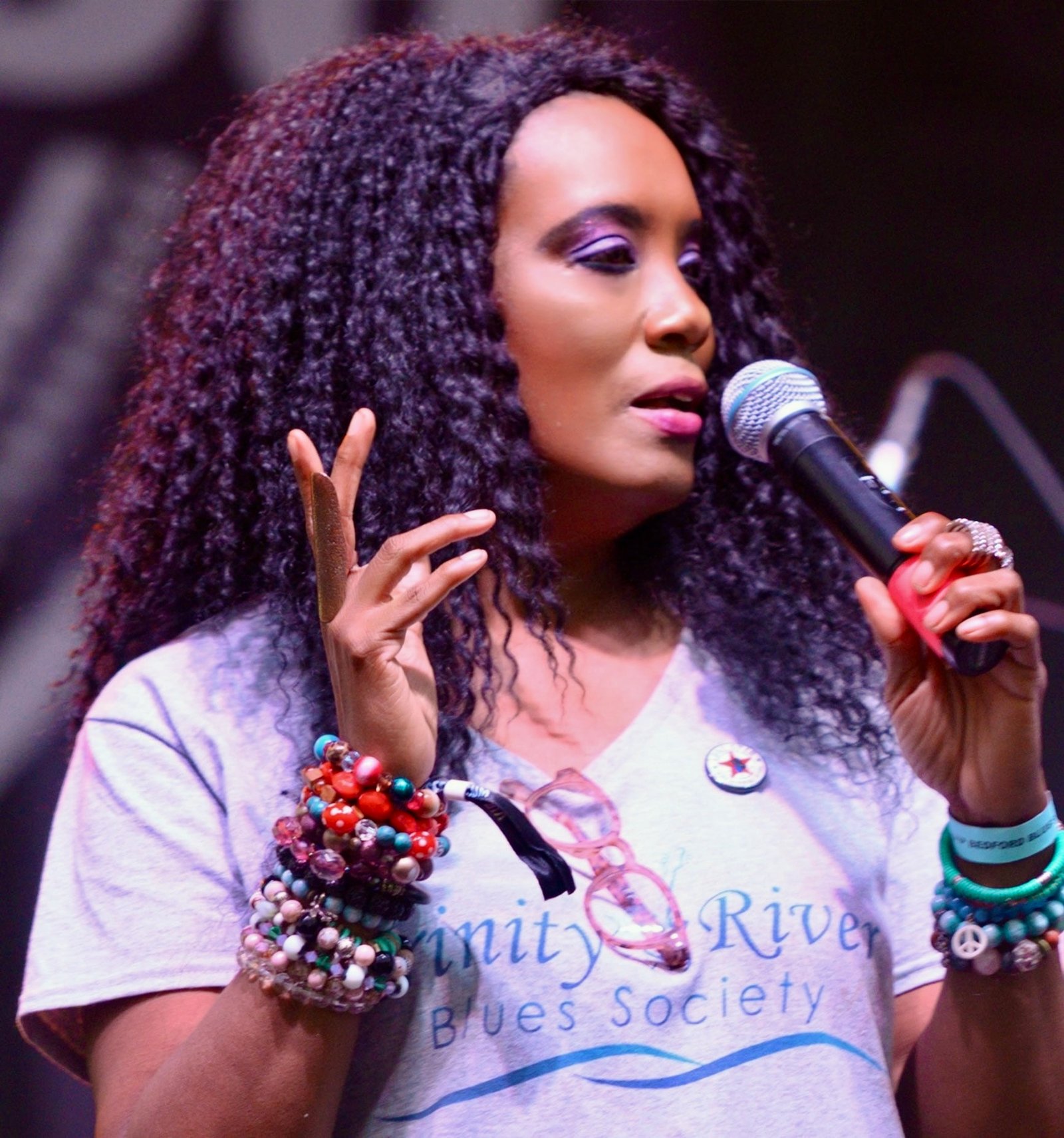 Angela R. Buffington speaking into a microphone at an event